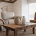 Rustic country coastal cottage living room featuring a reclaimed wood coffee table, vintage quilt on a linen sofa, whitewashed shiplap, and woven seagrass seating in soft natural daylight.